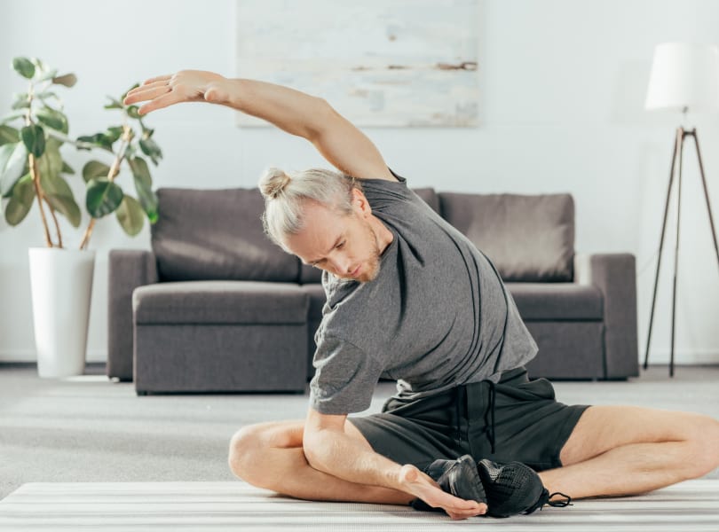 male-stretching-home